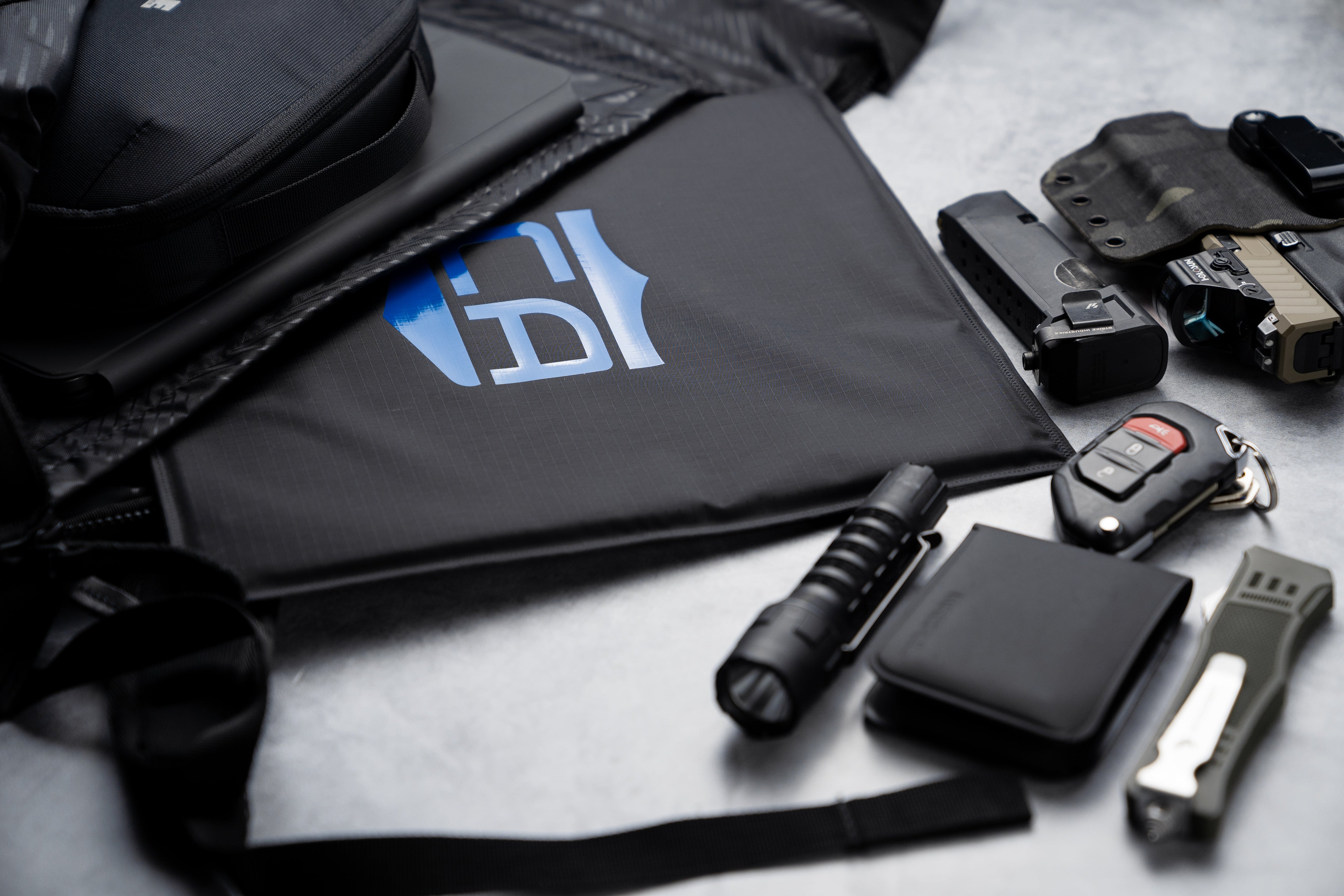 Woman putting bulletproof panel in backpack