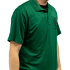 Compression concealable body armor being worn by a model under a green polo dress shirt on a white background