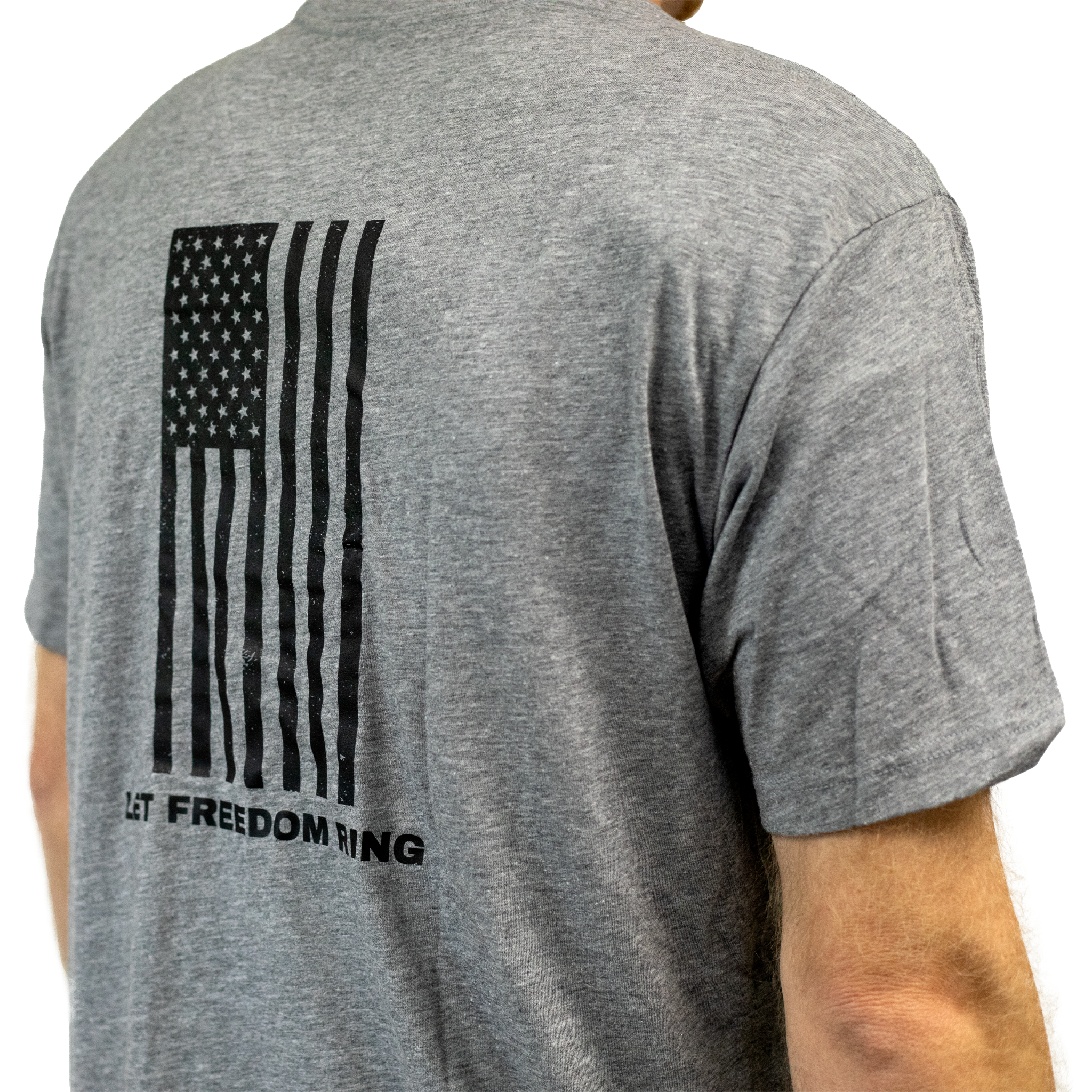 Compression concealable body armor being worn by a model under a t-shirt on a white background
