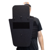 Front of black 15" x 25" Caliber Armor Pistol rated Level IIIA HG2 Ballistic Shield with pivoting handle held by a man a white background