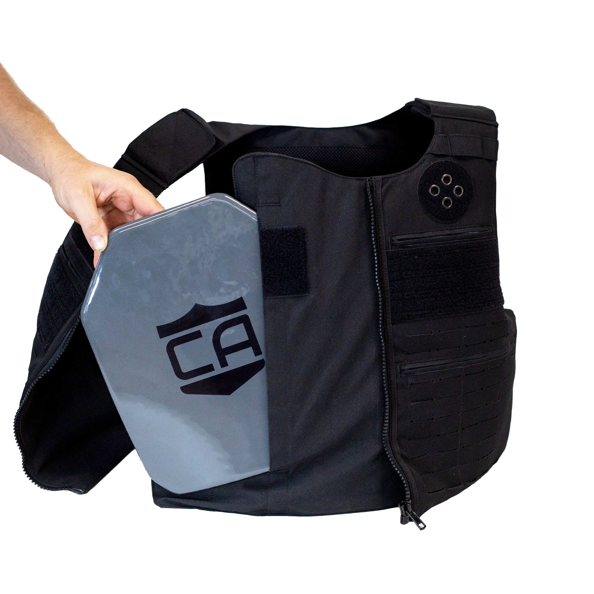 Black tactical vest with a gray armor plate being side loaded into the front of the vest