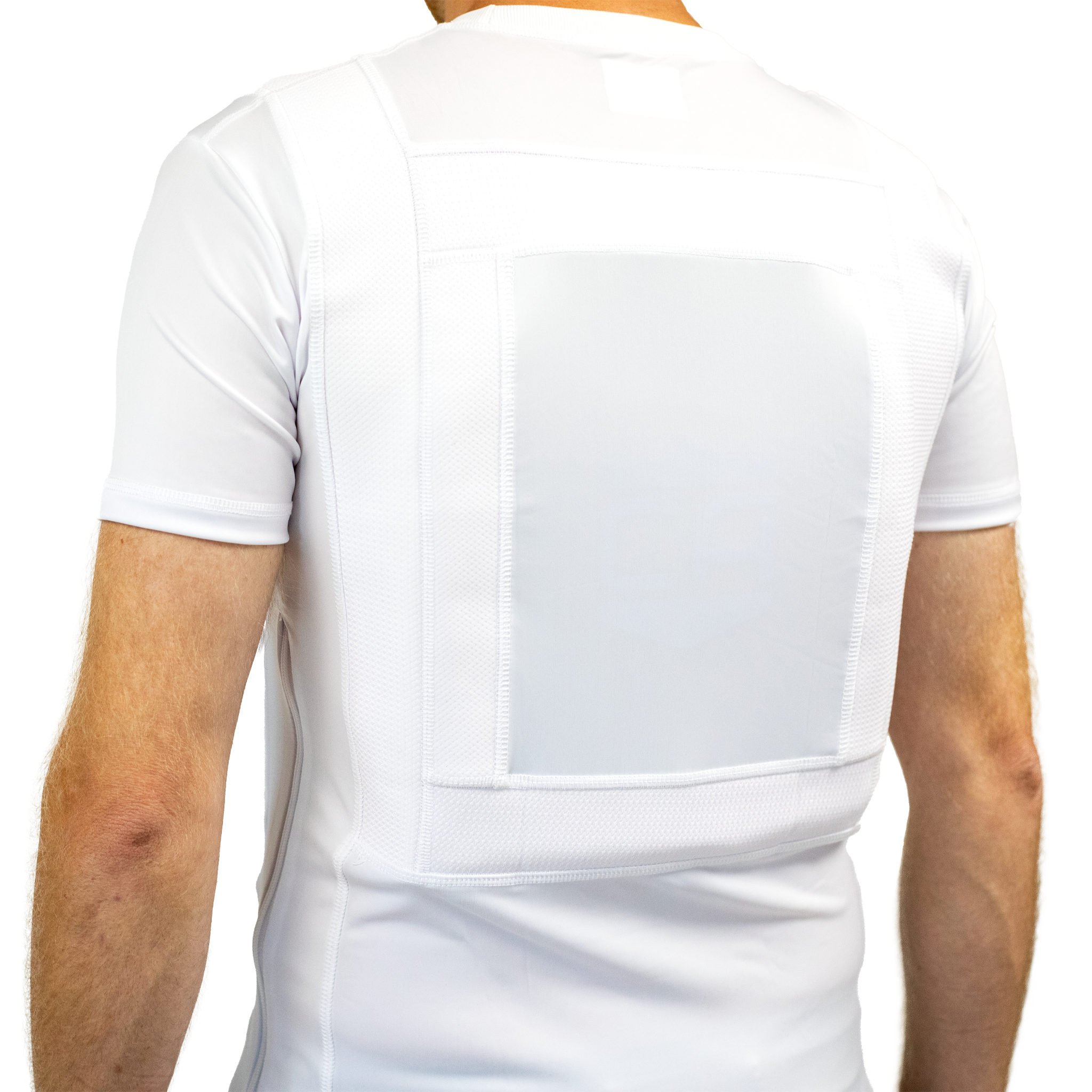 Back view of a white compression concealable body armor t-shirt worn by a man on a white background