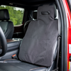 Black CaliberX Core Rapid Deployment Ballistic Vehicle seat shield installed on the driver's seat in a red truck with black interior