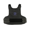 Front view of Caliber Armor covert hybrid concealable carrier in black laying flat on a white background, faint blue "CA Caliber Armor" logo visible in the center of the chest