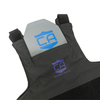 Front view of Caliber Armor covert hybrid concealable carrier in black laying flat on a white background, with a speed plate bein inserted into it's front plate pocket, blue "CA Caliber Armor" logo visible in the center of the chest and on the speed plate