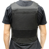 Rear view of man wearing a Caliber Armor covert hybrid concealable carrier in black, two cummerbund straps per side that velcro to adjust fit, rear plate pocket with velcro closure