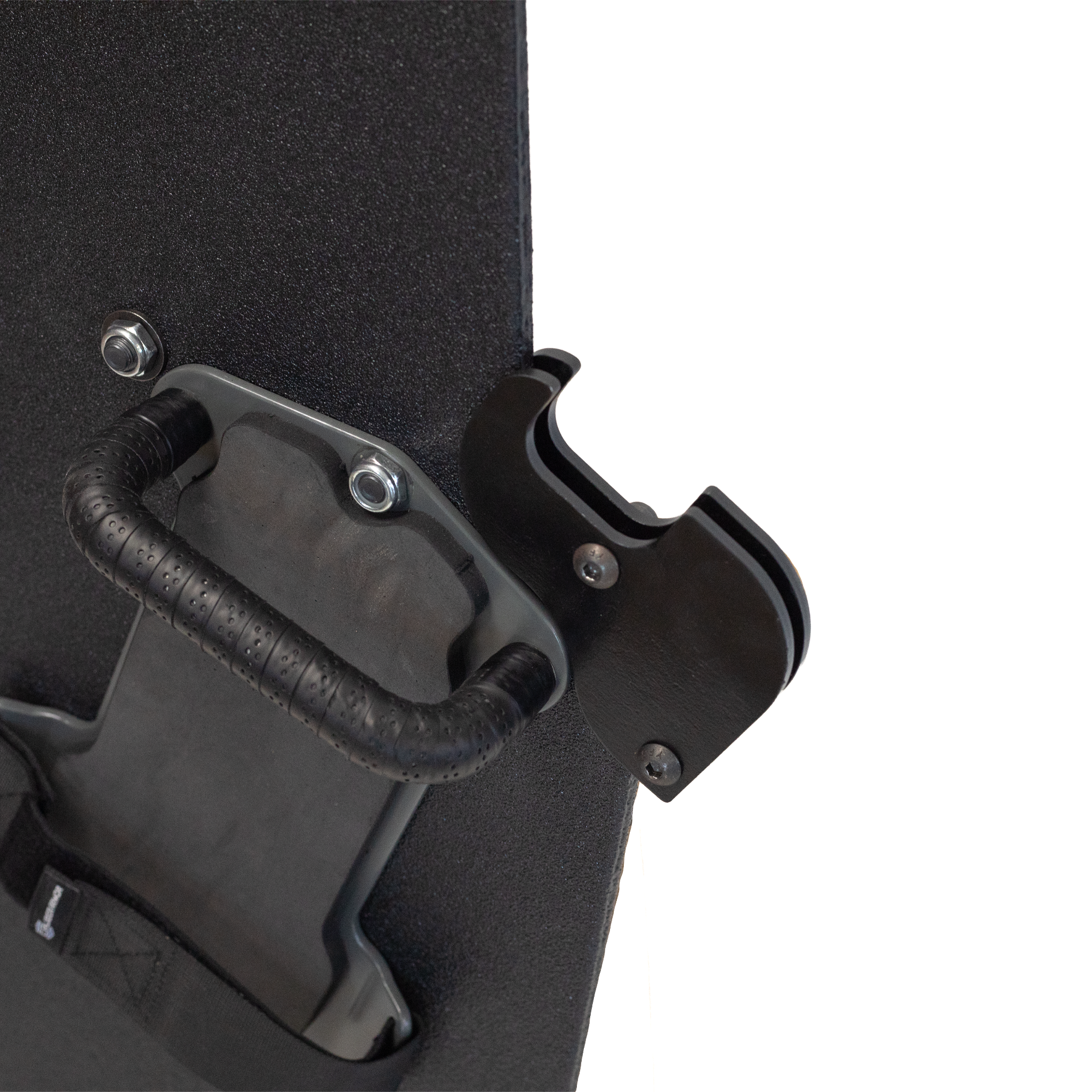 Close-up of backside of a black protective shield with a handle and gun support bracket mounted on a white background